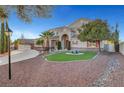 Beautiful home with red shutters, a well-manicured lawn and mature trees, set back on a spacious lot at 7771 Pleasant Slopes Ct, Las Vegas, NV 89131
