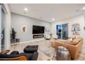 Stylish living room featuring modern decor, a sleek fireplace, and comfortable seating arrangement at 800 Loch Katrine Ave, Henderson, NV 89012