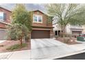 Inviting two-story home featuring a well-kept lawn and a two-car garage at 937 Spiracle Ave, Henderson, NV 89002