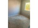 Bedroom with a large window, carpet, and electrical outlet at 1805 Monte Alban Dr, North Las Vegas, NV 89031