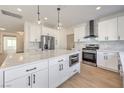 Modern kitchen features stainless steel appliances, marble countertops, and an open design at 2581 Terrytown Ave, Henderson, NV 89052