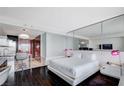 Contemporary bedroom boasts a king-sized bed and views into the kitchen at 4381 W Flamingo Rd # 3007, Las Vegas, NV 89103