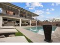 Gorgeous backyard pool with lots of seating, and outdoor dining space under covered patio at 638 Paloma Dr, Boulder City, NV 89005