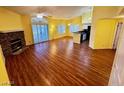 Sun-filled living room with wood floors, fireplace, and sliding glass doors at 7231 Indian Creek Ln # 204, Las Vegas, NV 89149