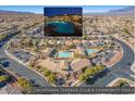 Aerial view showcasing the community pool, clubhouse, and surrounding residential area with mountain views at 7735 Sugarloaf Peak St, Las Vegas, NV 89166