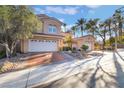 Charming two-story home featuring a well-maintained yard, a tile roof, and a two-car garage at 8225 Taos Paseo Ave, Las Vegas, NV 89128