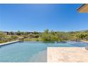 Stunning pool area perfect for relaxation and entertainment at 11473 Glowing Sunset Ln, Las Vegas, NV 89135