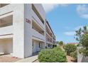 Condominium building featuring multiple balconies and a textured exterior at 1381 E University Ave # 301, Las Vegas, NV 89119