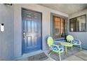 Inviting front porch area featuring seating and a welcoming entrance door at 1915 Trilly Ln, Las Vegas, NV 89156