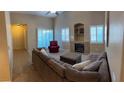Bright living room with tile entry, plush furniture, fireplace and lots of natural light at 2152 Turquoise Ridge St # 207, Las Vegas, NV 89117