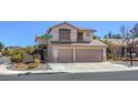 Charming two-story home featuring a two-car garage and well-maintained front yard at 2180 Maple Shade St, Henderson, NV 89002