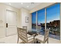Dining area featuring a glass table and panoramic views of the Las Vegas skyline at 2877 Paradise Rd # 2703, Las Vegas, NV 89109