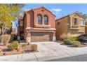 Inviting two-story home with a two-car garage and well-maintained landscaping at 4740 Killington St, Las Vegas, NV 89129