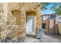 The entryway features a white front door, a Vivint security sign, and decorative stone accents at 648 Sumatra Pl, Henderson, NV 89011