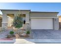 Charming single-story home featuring a stylish paver driveway and a two-car garage at 8729 Marcana St, Las Vegas, NV 89166