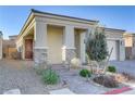 Inviting front porch with stone accents and a well-manicured yard offers great curb appeal at 8729 Marcana St, Las Vegas, NV 89166