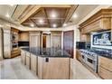 Gourmet kitchen features a central island, stainless steel appliances, and custom cabinetry at 9103 Alta Dr # 1502, Las Vegas, NV 89145
