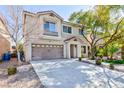 Lovely two-story home with a welcoming entrance and attached two-car garage at 10608 Medicine Bow St, Las Vegas, NV 89183