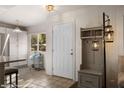 Inviting entryway with stylish decor, including a coat rack and modern lighting fixture at 378 Colleen Ct # G, Mesquite, NV 89027
