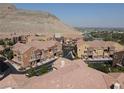 Beautiful aerial view of a residential area with well-maintained homes and scenic mountain backdrop at 3850 Juno Beach St # 203, Las Vegas, NV 89129