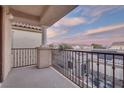 Balcony area showcasing wrought iron fencing, a view of the neighborhood, and great lighting at 6632 Biltmore Garden St, Las Vegas, NV 89149