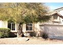 Attractive single-Gathering home with mature shade tree, low maintenance yard and attached garage at 7515 Splashing Rock Dr, Las Vegas, NV 89131