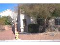 Charming single-story home featuring a well-maintained yard and mature tree for added curb appeal at 7515 Splashing Rock Dr, Las Vegas, NV 89131