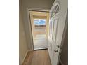 Inviting entryway with an open door, wood-look flooring, and a view of the landscape at 790 E Basin, Pahrump, NV 89060
