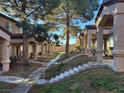 Charming townhome community with mature trees and well-maintained landscaping at 1920 Hodgenville St # 106, Las Vegas, NV 89106