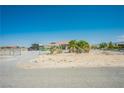 Wide angle showing the home's gravel front yard and fenced perimeter at 1920 Silver St, Pahrump, NV 89048