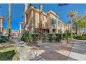 Beautiful condo exterior featuring a well-manicured lawn at 251 S Green Valley Pkwy # 1514, Henderson, NV 89012