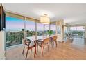 Bright dining room boasts floor-to-ceiling windows with stunning views at 3111 Bel Air Dr # 7D, Las Vegas, NV 89109