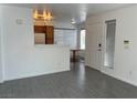 Open-concept living room with eat-in counter and tile floors throughout at 3119 Key Largo Dr # 204, Las Vegas, NV 89120