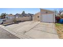 A charming single-story home with a two-car garage and spacious concrete driveway at 4136 Broadriver Dr, Las Vegas, NV 89108