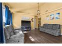 A cozy living room with hardwood floors and contemporary furnishings at 4136 Broadriver Dr, Las Vegas, NV 89108