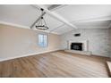 Spacious living room with a fireplace and abundant natural light at 7477 Ullom Dr, Las Vegas, NV 89139