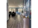 Bright living room featuring hardwood floors, plantation shutters, and stylish decor at , Las Vegas, NV 89110