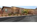 Inviting single-story home featuring a low-maintenance front yard and brick accents at 10179 Emerald Sunset Ct, Las Vegas, NV 89148