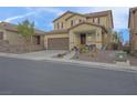 Charming two-story home with a well-maintained yard, front porch, and two car garage at 193 Calabria Peak Ct, Henderson, NV 89012