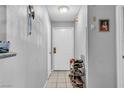 Home entryway featuring tile flooring, a coat closet, and shoe storage at 2200 S Fort Apache Rd # 1007, Las Vegas, NV 89117