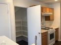 A kitchen view showcases the pantry, range, countertop, and cabinets at 2736 Stargate St, Las Vegas, NV 89108