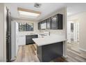 Updated kitchen featuring sleek black cabinets, white countertops, and stainless steel appliances at 2851 S Valley View Blvd # 1150, Las Vegas, NV 89102