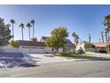 A beautiful single-Gathering home with a three-car garage surrounded by lush landscaping at 3431 Iberia St, Las Vegas, NV 89146