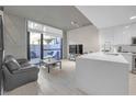 Bright open living space with a modern kitchen and access to an outdoor patio at 353 E Bonneville Ave # 752, Las Vegas, NV 89101