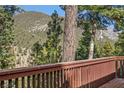 Wooden porch overlooking views of the surrounding mountains and lush forestry at 4154 Matterhorn Way, Mount Charleston, NV 89124