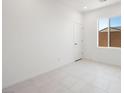 Bright, minimalist bedroom with a large window at 4485 E Brusca Way, Pahrump, NV 89061