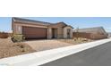 Single-story home featuring a brick driveway, desert landscaping, and a two-car garage at 4485 E Brusca Way, Pahrump, NV 89061