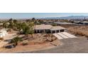 Desert home featuring a three-car garage, low maintenance landscaping, and mountain views at 8290 Gagnier Blvd, Las Vegas, NV 89113