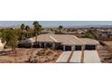 Expansive desert home with three-car garage, landscaped yard, and views of the city at 8290 Gagnier Blvd, Las Vegas, NV 89113