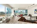 Spacious living room with floor-to-ceiling windows showcasing vibrant city views at 4525 Dean Martin Dr # 2800, Las Vegas, NV 89103